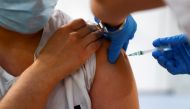 FILE PHOTO: A health worker receives an injection with her second dose of the Pfizer-BioNTech COVID-19 vaccine, as the coronavirus disease (COVID-19) outbreak continues, at Enfermera Isabel Zendal new pandemic hospital in Madrid, Spain, February 4, 2021. 