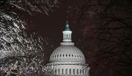 The U.S. Capitol is seen through ice-covered tree branches after the Senate voted to acquit former U.S. President Donald Trump during his impeachment trial, in Washington, U.S. February 13, 2021. REUTERS/Erin Scott
