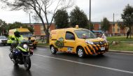 DHL company vans transporting a batch of doses of the Pfizer-BioNTech COVID-19 Vaccine enter the free zone, as the coronavirus disease (COVID-19) outbreak continues, in Bogota, Colombia, February 15, 2021. REUTERS/Luisa Gonzalez
