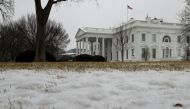 A thin coating of snow and ice covers the lawn in front of the White House in Washington, U.S. February 18, 2021. REUTERS/Jonathan Ernst

