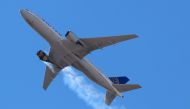 United Airlines flight UA328 returns to Denver International Airport with its starboard engine on fire after it called a Mayday alert, over Denver, Colorado, US February 20, 2021. Hayden Smith/@speedbird5280/Handout via REUTERS
