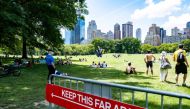 FILE PHOTO: People enjoy the weather in Central Park, the day before the city starts phase two of reopening after the lockdown due to the coronavirus disease (COVID-19), in the Manhattan borough of New York City, U.S., June 21, 2020. REUTERS/Jeenah Moon
