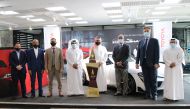 Officials from Abdullah Abdulghani & Bros. Co. (AAB) and Qatar Stars League, during the Qatar Cup Trophy Tour at the AAB Tower’s Toyota showroom in Doha, recently. 