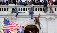 FILE PHOTO: A mob of supporters of former U.S. President Donald Trump fight with members of law enforcement at a door they broke open as they storm the U.S. Capitol Building in Washington, U.S., January 6, 2021. REUTERS/Leah Millis/File Photo
