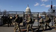 National Guard soldiers patrol the grounds of the U.S. Capitol after police warned that a militia group might try to attack the Capitol complex in Washington, U.S. March 4, 2021. REUTERS/Jonathan Ernst
