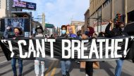 Protesters march through downtown Minneapolis during the 