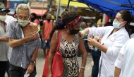 People receive the first dose of Sinovac's CoronaVac coronavirus disease (COVID-19) vaccine for senior citizens, in Duque de Caxias, Rio de Janeiro state, Brazil March 5, 2021. REUTERS/Pilar Olivares
