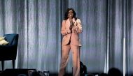 Former first lady Michelle Obama takes the stage at the Royal Arena during her book tour for her biography 