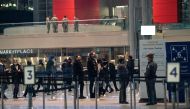 People wait in a line stretching inside the Jacob K. Javits Convention Center on midtown Manhattan's west side, to receive a dose of the coronavirus disease (COVID-19) vaccine at the site which has been converted into a mass vaccination center in New York