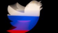 A 3d printed Twitter logo is pictured in front of a displayed Russian flag in this illustration taken March 10, 2021. Reuters/Dado Ruvic/Illustration