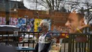 Herb Pasternak wears a mask while dining outdoors as the state of Texas lifts its mask mandate and allows businesses to reopen at full capacity during the coronavirus disease (COVID-19) pandemic in Houston, Texas, U.S., March 10, 2021. REUTERS/Callaghan O