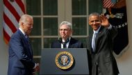 FILE PHOTO: Judge Merrick Garland (C) shakes hands with Vice-President Joe Biden (L) as President Barack Obama waves after Obama announced Garland as his nominee to the U.S. Supreme Court in the Rose Garden of the White House in Washington D.C., March 16,