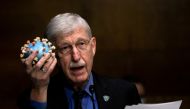 FILE PHOTO: National Institutes of Health Director Francis S. Collins holds a model of SARS-CoV-2, the novel coronavirus, as he testifies on Capitol Hill in Washington, D.C., U.S., July 2, 2020. Graeme Jennings/Pool via REUTERS/File Photo
