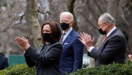U.S. President Joe Biden is applauded by Vice President Kamala Harris and Senate Majority Leader Chuck Schumer (D-NY) as he arrives to speak about the $1.9 trillion 
