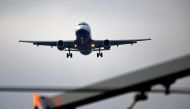 FILE PHOTO: An airplane prepares to land at Cointrin airport in Geneva, Switzerland December 5, 2017. REUTERS/Pierre Albouy/File Photo

