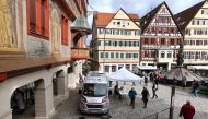 People queue outside a COVID-19 rapid test centre to get a day pass to visit shops and cultural institutions as the spread of the coronavirus disease (COVID-19) continues in Tuebingen, Germany, March 17, 2021. REUTERS/Kai Pfaffenbach