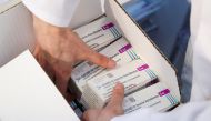 A medical worker unpacks a box of Oxford/AstraZeneca's COVID-19 vaccine at a vaccination centre in Bierset, Belgium March 17, 2021. REUTERS/Yves Herman