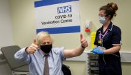 FILE PHOTO: British Prime Minister Boris Johnson reacts after receiving a dose of the Oxford/AstraZeneca COVID-19 vaccine, amid the coronavirus disease pandemic, in London, Britain March 19, 2021. Frank Augstein/Pool via REUTERS/File Photo
