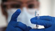 A nurse draws from a vial of Johnson & Johnson coronavirus disease (COVID-19) vaccine, in Los Angeles, California, U.S., March 25, 2021. REUTERS/Lucy Nicholson/File Photo