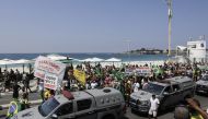 Demonstrators protest against new measures implemented to curb the spread of the coronavirus disease (COVID-19) in Rio de Janeiro, Brazil March 26, 2021. REUTERS/Ricardo Moraes