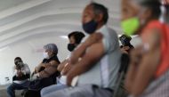 Elderly people hold bandages after receive China's Sinovac Biotech vaccine against the coronavirus disease (COVID-19) during the mass vaccination program for the elderly people in Mexico City, Mexico March 25, 2021. REUTERS/Edgard Garrido