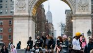 :FILE PHOTO: People wearing protective masks are seen in Washington Square park during the outbreak of the coronavirus disease (COVID-19) in the Manhattan borough of New York City, New York, U.S., March 25, 2021. REUTERS/Jeenah Moon/File Photo
