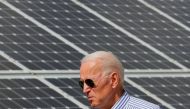 File photo: Democratic 2020 U.S. presidential candidate and former Vice President Joe Biden walks past solar panels while touring the Plymouth Area Renewable Energy Initiative in Plymouth, New Hampshire, U.S., June 4, 2019. Reuters/Brian Snyder/File Photo