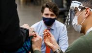 Canada's Prime Minister Justin Trudeau watches as nurse Thi Nguyen gives a COVID-19 vaccination at a clinic, as efforts continue to help slow the spread of the coronavirus disease, in Ottawa, Ontario, Canada March 30, 2021. REUTERS/Blair Gable
