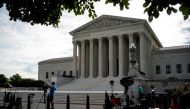FILE PHOTO: Members of the media set up in front of the U.S. Supreme Court building in Washington, U.S., June 25, 2020. REUTERS/Al Drago/File Photo

