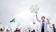 Nurses hold balloons during a protest asking for COVID-19 vaccines and in favour of SUS (Unique Health System) during World Health Day in Brasilia, Brazil April 7, 2021. REUTERS/Adriano Machado
