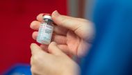 A nurse holds a vial of the Moderna coronavirus disease (COVID-19) vaccine at the Glangwili General Hospital in Carmarthen, Wales, Britain April 7, 2021. Jacob King/Pool via REUTERS
