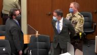 Former Minneapolis police officer Derek Chauvin is led away in handcuffs past his defense attorney Eric Nelson after a jury found him guilty of all charges in his trial for second-degree murder, third-degree murder and second-degree manslaughter in the de