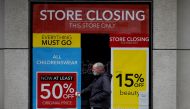 FILE PHOTO: A man walks past a closed branch of Debenhams amid the outbreak of the coronavirus disease (COVID-19) in Liverpool, Britain, February 23, 2021. REUTERS/Phil Noble/File Photo
