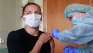 Maryna Bekh-Romanchuk, a long jumper of the Ukrainian Olympic team that will compete in the Tokyo 2020 Olympics, receives a dose of the Chinese-developed CoronaVac vaccine against the coronavirus disease (COVID-19) in Kyiv, Ukraine April 30, 2021. REUTERS