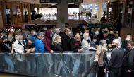 People wait to get shots of vaccines against the coronavirus disease (COVID-19) in the Usce shopping mall, where the first 100 vaccinated will receive a discount voucher worth 3,000 dinars ($30.74) secured by mall's management and retailers, in Belgrade, 
