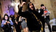 People celebrate on a street in the neighborhood of Born, as the state of emergency decreed by the Spanish Government to prevent the spread of the coronavirus disease (COVID-19) gets lifted in Barcelona, Spain, May 9, 2021. REUTERS/Nacho Doce
