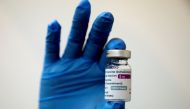 FILE PHOTO: A medical worker holds a bottle of AstraZeneca's COVID-19 vaccine at a vaccination centre in Kuala Lumpur, Malaysia May 5, 2021 in this file photo. REUTERS/Lim Huey Teng/File Photo
