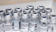 Empty vials of the Pfizer-BioNTech coronavirus disease (COVID-19) vaccine are seen at The Michener Institute, in Toronto, Canada January 4, 2021. REUTERS/Carlos Osorio/File Photo