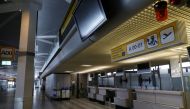 FILE PHOTO: Former check-in desks are seen during the media tour at the former Berlin Tegel airport during the last day before the end of operation in Berlin, Germany, May 4, 2021. REUTERS/Michele Tantussi