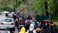 Residents queue at a sports hall to get vaccinated against the coronavirus disease (COVID-19) in Berlin, Germany, May 14, 2021. REUTERS/Axel Schmidt