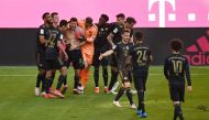Bayern Munich's Robert Lewandowski celebrates scoring their fifth goal with teammates Pool via REUTERS/Sven Hoppe DFL regulations prohibit any use of photographs as image sequences and/or quasi-video.