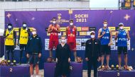 Qatar’s Cherif Younousse and Ahmed Tijan (left) pose with their silver medals on the podium, along with other medal winners and officials in Sochi, yesterday.  