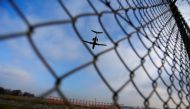 FILE PHOTO: An airplane prepares to land at Cointrin airport in Geneva, Switzerland, December 5, 2017. REUTERS/Pierre Albouy