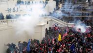 Police release tear gas into a crowd of pro-Trump protesters during clashes at a rally to contest the certification of the 2020 U.S. presidential election results by the U.S. Congress, at the U.S. Capitol Building in Washington, U.S, January 6, 2021. REUT