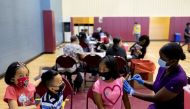 FILE PHOTO: Victoria Zaca, 12, receives a coronavirus disease (COVID-19) vaccine at a clinic run by the Philadelphia Department of Public Health in partnership with the Black Doctors COVID-19 Consortium to encourage all eligible teenagers to get vaccinate