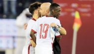 Coach Felix Sanchez celebrates with Almoez Ali and Bassam Al Rawi after the match. Pic: Hussain Sayed