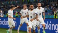 Italy’s Lorenzo Insigne celebrates scoring their third goal with team-mates.