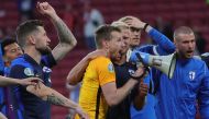 Finland's Lukas Hradecky celebrate after the match with teammates Pool via REUTERS/Friedemann Vogel
