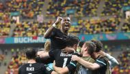 Soccer Football - Euro 2020 - Group C - Austria v North Macedonia - National Arena, Bucharest, Romania - June 13, 2021 Austria's Michael Gregoritsch celebrates scoring their second goal with David Alaba and teammates Pool via REUTERS/Daniel Mihailescu

