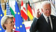 US President Joe Biden crosses his fingers next to European Commission President Ursula von der Leyen as they attend the EU-US summit, in Brussels, Belgium June 15, 2021. Reuters/Yves Herman